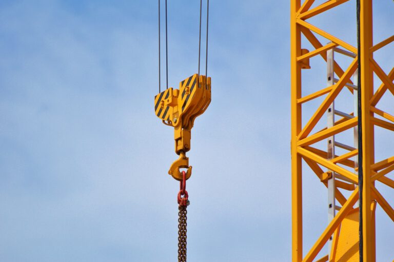 Crane pulley with blue sky in the background